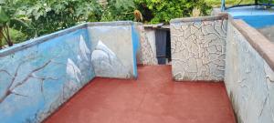 a ramp with two doors and a red path at Viktor 's rooms for rent in Maria