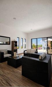 a living room with couches and a table at LUZ DE LUNA mesa de los santos house in Los Santos