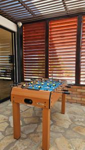 a wooden table with a chess board on it at LUZ DE LUNA mesa de los santos house in Los Santos