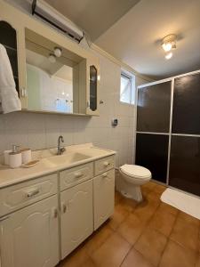 a bathroom with a sink and a toilet and a shower at Ed Las Vegas by Select Stays in Chapecó +5 photos