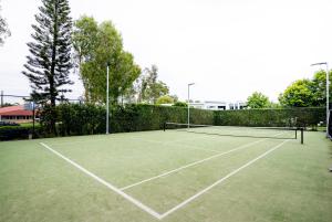 a tennis court with a net on top of it at Allisee Apartments in Gold Coast