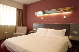 Postel nebo postele na pokoji v ubytování Motel Xiamen Railway Station