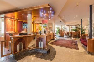 a lobby with a bar in a building at Hotel Eitljörg in Vienna