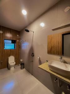 a bathroom with a sink and a toilet at Casa Aqua Mandrem in Mandrem +37 photos