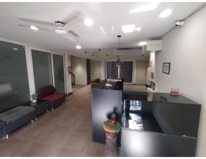 an empty lobby of an office building with a couch at RJK Sector 49 Residency Near Huda Metro Station in Gurgaon