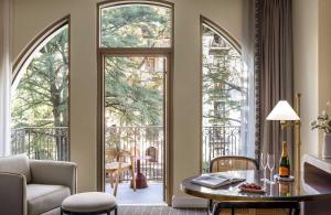 a living room with an open door to a balcony at Mokara Hotel & Spa in San Antonio