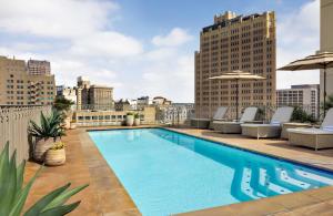 a swimming pool on the roof of a building at Mokara Hotel & Spa in San Antonio