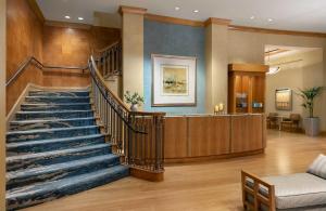 a lobby with a staircase and a waiting room at Mokara Hotel & Spa in San Antonio +41 photos