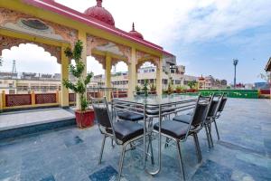 a table and chairs on an outdoor patio at Hotel Vijay Niwas in Jaipur