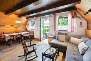 a living room with a couch and a table at Hugo's House in Rakitna +26 photos