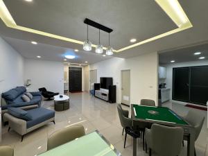 a living room with a pool table and a tv at Lan Yang Resort Four Seasons in Dongshan