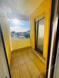 an empty room with a view of a balcony at Modern 2-Room Apartment with Free Parking and Balcony in Waldmohr