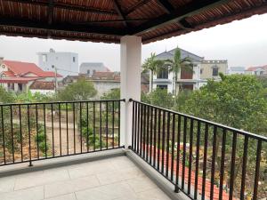 a balcony with a view of a city at The Little Home in Xuân Dục