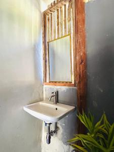 a bathroom with a sink and a mirror at Whatsup pai in Pai +26 photos