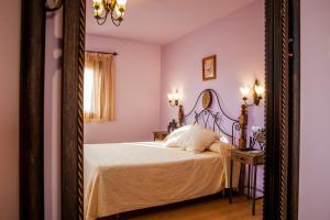 a bedroom with a bed and a mirror at Pensión Ametzagaña in San Sebastián
