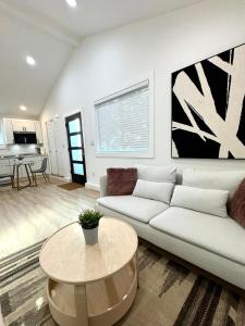 a living room with a couch and a table at Modern and Cozy Private Studio in Lynnwood