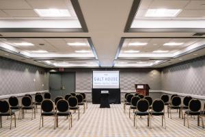 a conference room with chairs and a screen with a presentation at Galt House Hotel, A Trademark Collection Hotel in Louisville +109 photos