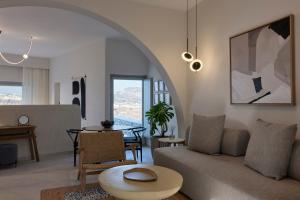 a living room with a couch and a table at Apanemo Private Suites in Akrotiri