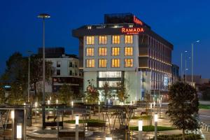 a building with a sign on the top of it at Ramada by Wyndham Arnavutkoy in Istanbul