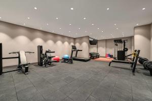 a gym with treadmills and exercise equipment in a room at Ramada by Wyndham Arnavutkoy in Istanbul