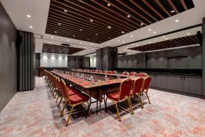 a large conference room with a long table and chairs at Ramada by Wyndham Arnavutkoy in Istanbul