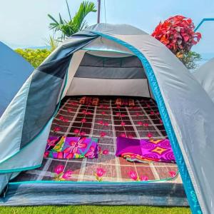 a tent with a bed inside of it at Camping At Pawana in Malavli +7 photos