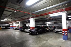 a parking garage with several cars parked in it at Travelodge Barcelona Poblenou in Barcelona