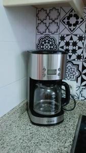 a food processor sitting on top of a counter at Frente Mar in L'Escala