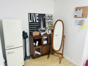 a mirror and a dresser in a room at 하우스 The 쉼 in Suwon +27 photos