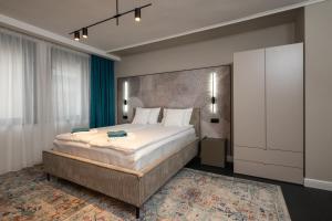 a bedroom with a large bed in a room at Къща Рустик in Belogradchik