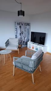 a living room with a couch and a table at Wohnung mit Herz in Schwyz