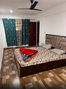 a bedroom with a bed with a blanket on it at Paradise Banihal Hotel in Banihāl +6 photos
