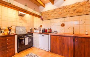 a kitchen with a stove and a dishwasher at Holiday Home Finca Ses Tanques in Algaida