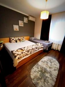 a bedroom with a bed and a rug at "Бадевски рай" Къща за гости ВЯРА in Elena +62 photos
