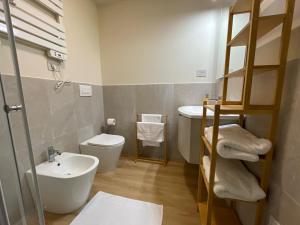 a small bathroom with a sink and a toilet at Patecchio2-IEO Fondazione Prada Villaggio Olimpico in Vigentino +55 photos