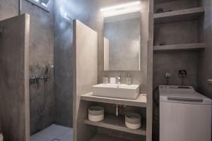 a bathroom with a sink and a toilet and a shower at Seaview Villa Euterpe in Ambelas +23 photos