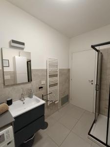 a bathroom with a sink and a shower at Lilli & Evoque Apartments in Civitanova Marche +38 photos