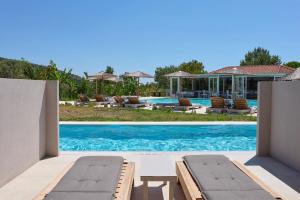 an image of a swimming pool at a villa at Pacifae Hotel in Katelios