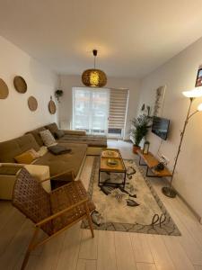 a living room with a couch and a table at Casa Shay Brasov in Braşov