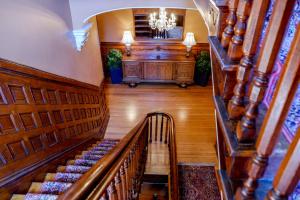 an overhead view of a staircase in a house with a piano at Kehoe House, Historic Inns of Savannah Collection in Savannah