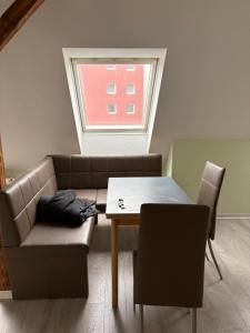 a living room with a couch and a table at Red Dot Apartment Lucky in Kamen