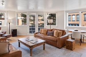 a living room with a couch and a table at Ice House 317 condo in Telluride