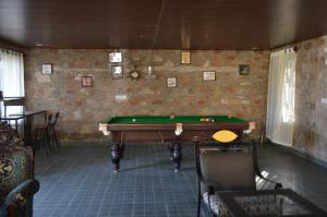 a room with a pool table in the middle of it at Bagh Ajabgarh in Ajabgarh