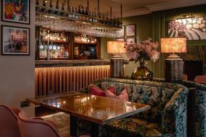 a bar with a couch and a table at Wentbridge House Hotel in Pontefract