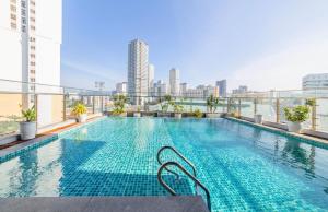 a swimming pool on top of a building at Em Oi Boutique Hotel in Nha Trang