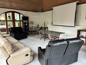 a living room with a couch and a table at Seaside Villa in Dauis