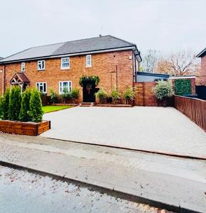 a large driveway in front of a brick house at Apartment style Space ideal for business & contractors in Minworth
