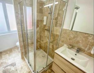a bathroom with a shower and a sink at La suite Carthagène des Indes - centre ville , spa & terrasse privée in Béthune +37 photos