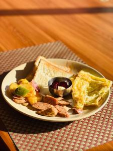 a plate of breakfast food on a table at The Himalayan Ridge in Kathmandu