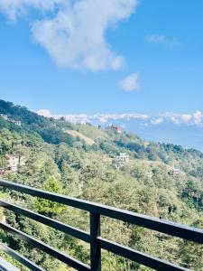 a balcony with a view of a mountain at The Himalayan Ridge in Kathmandu